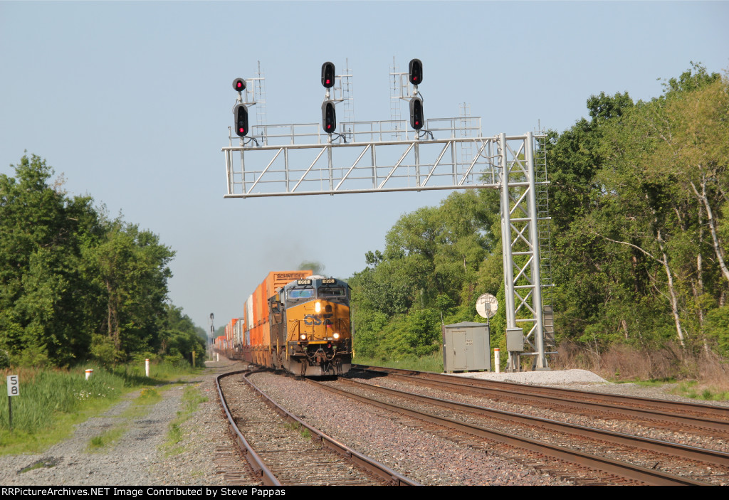 CSX 898 under a cantilever signal bridge